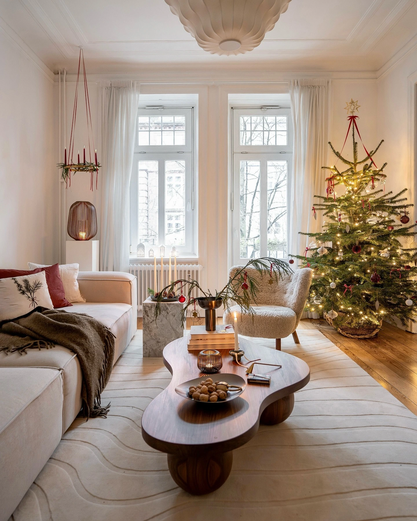1- Create a Cozy Glow with Candles and Mini Trees