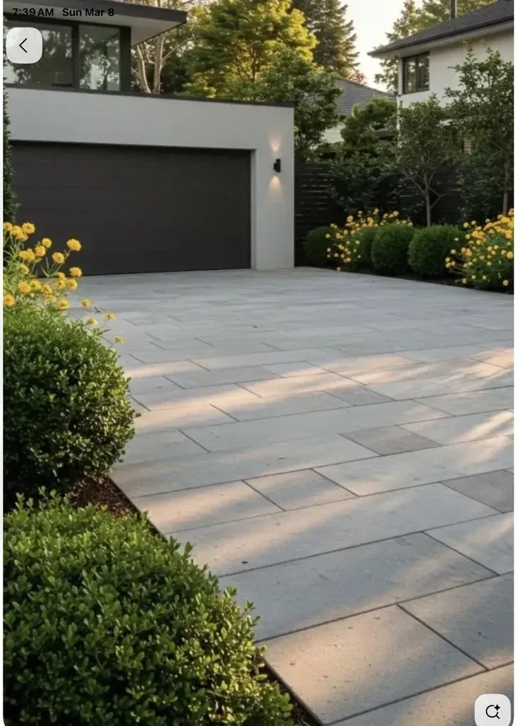 6- Frame the Drive with Structured Shrubs