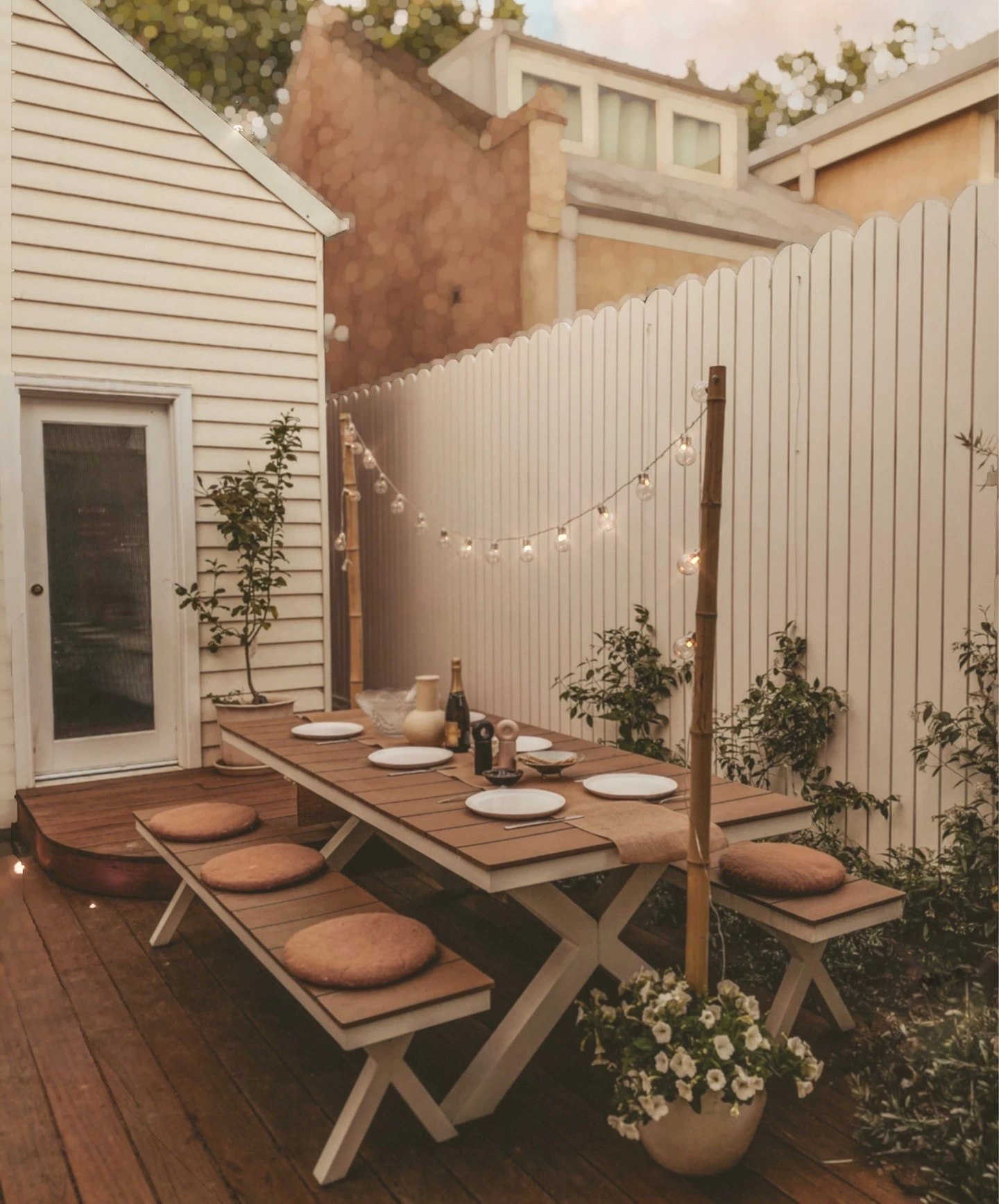 7- Light a Fence-Side Dining Spot