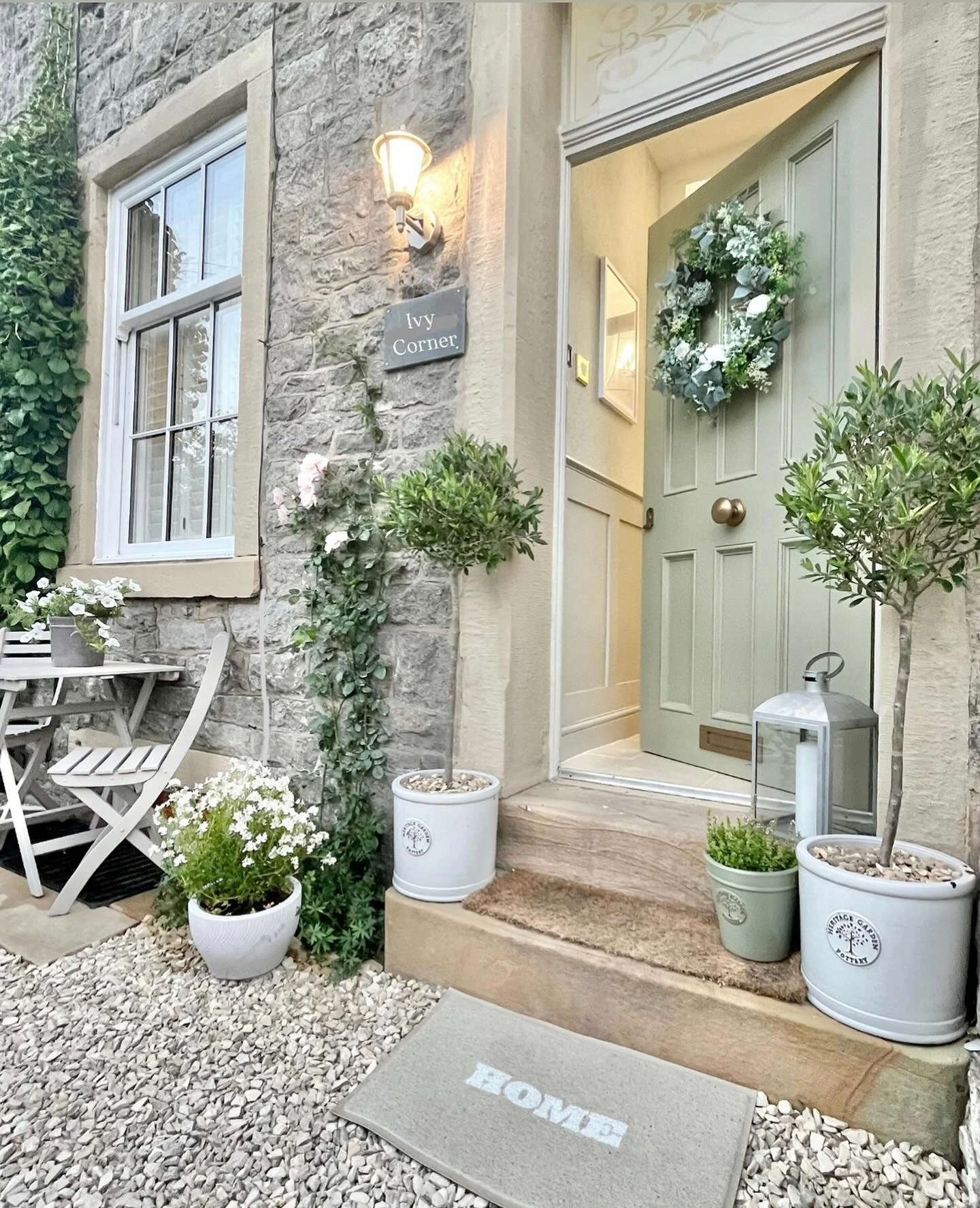7- Mix Topiaries with Cottage-Style Buckets