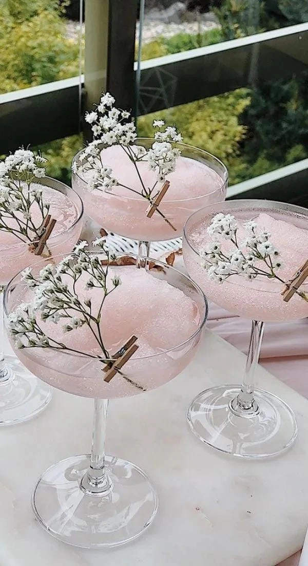 12- Serve Drinks in Pink Coupe Glasses