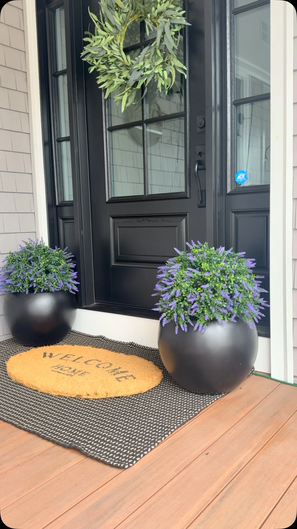 8- Soften a Dark Door With Round Pots