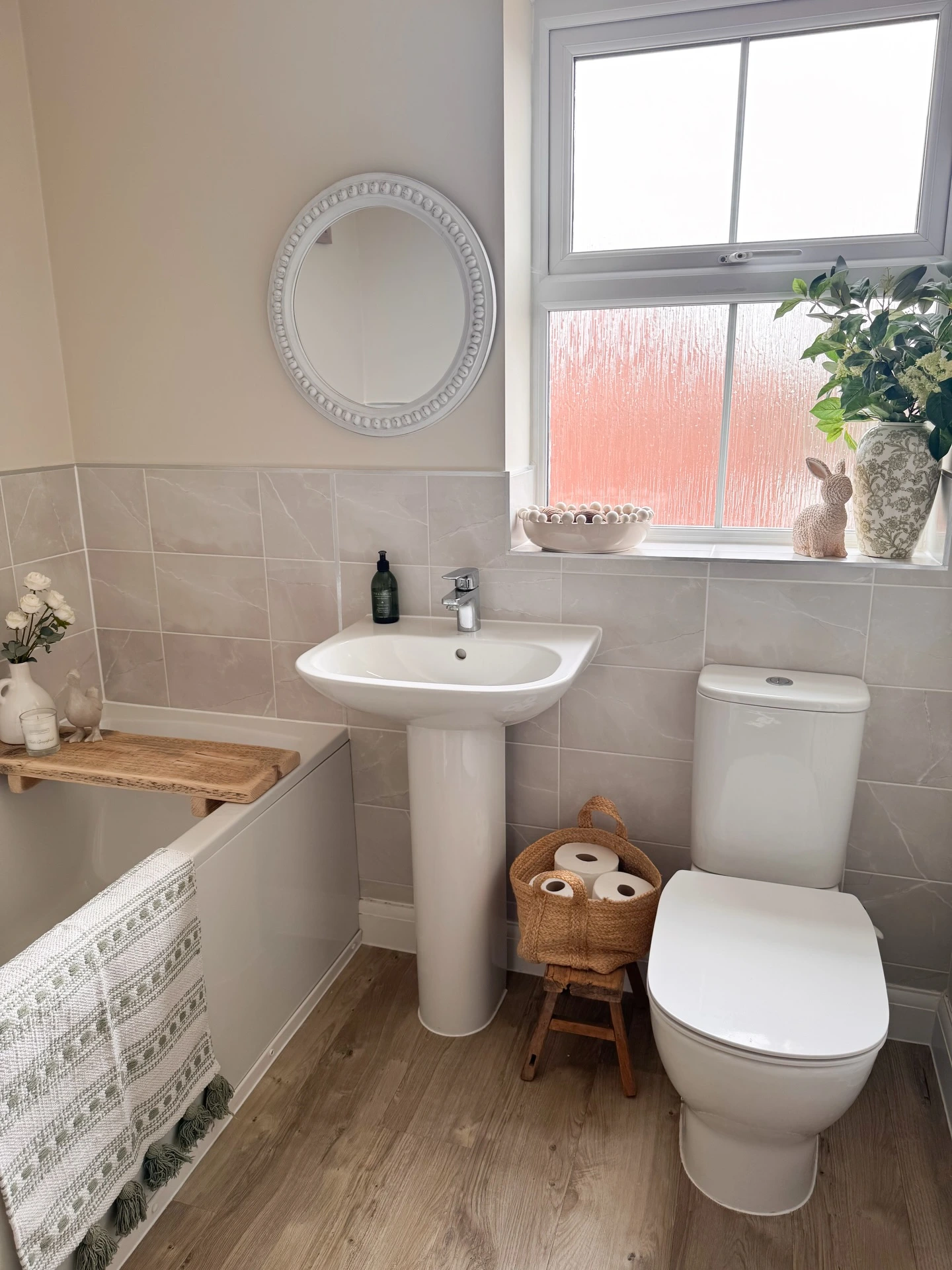 1- Tuck Extra Towels into a Small Stool