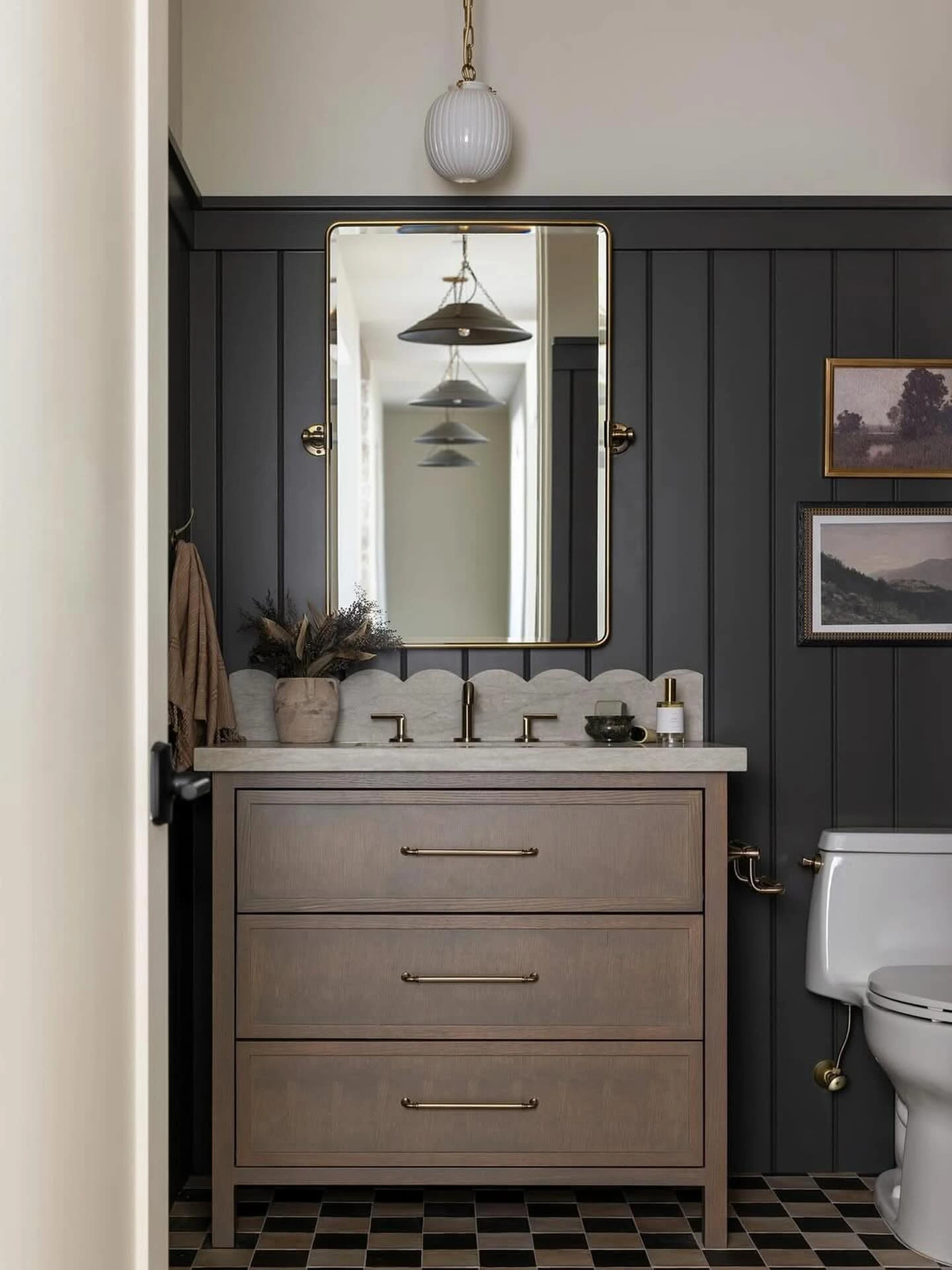 6- Use Dark Paneling with a Simple Vanity