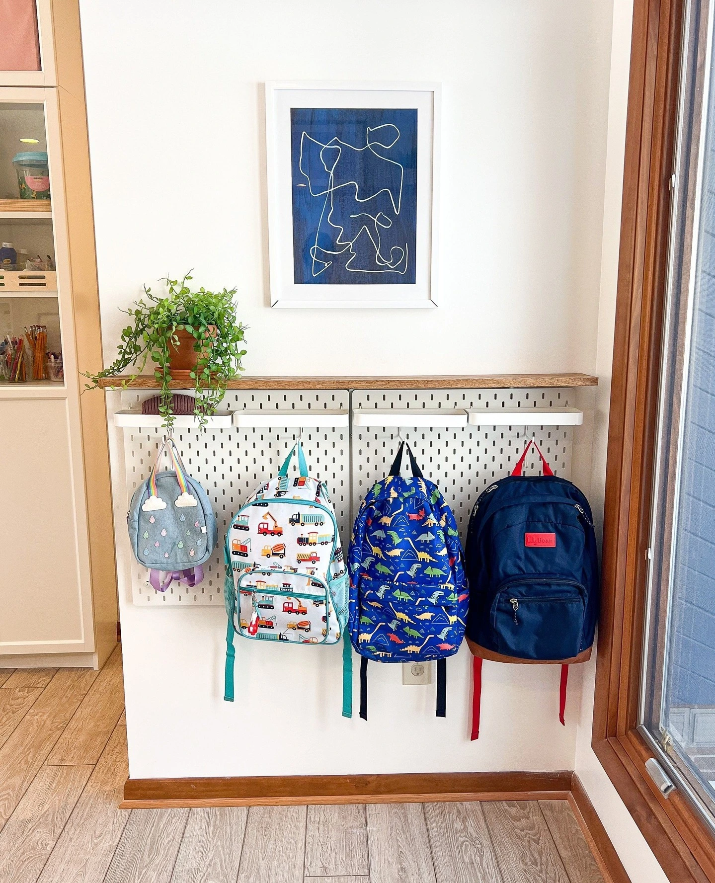 13- Hang Low Hooks Beneath Simple Wall Art