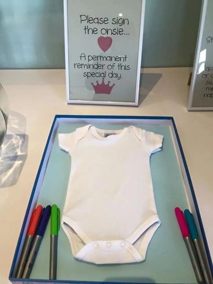 17- Set Up a Signing Onesie Station
